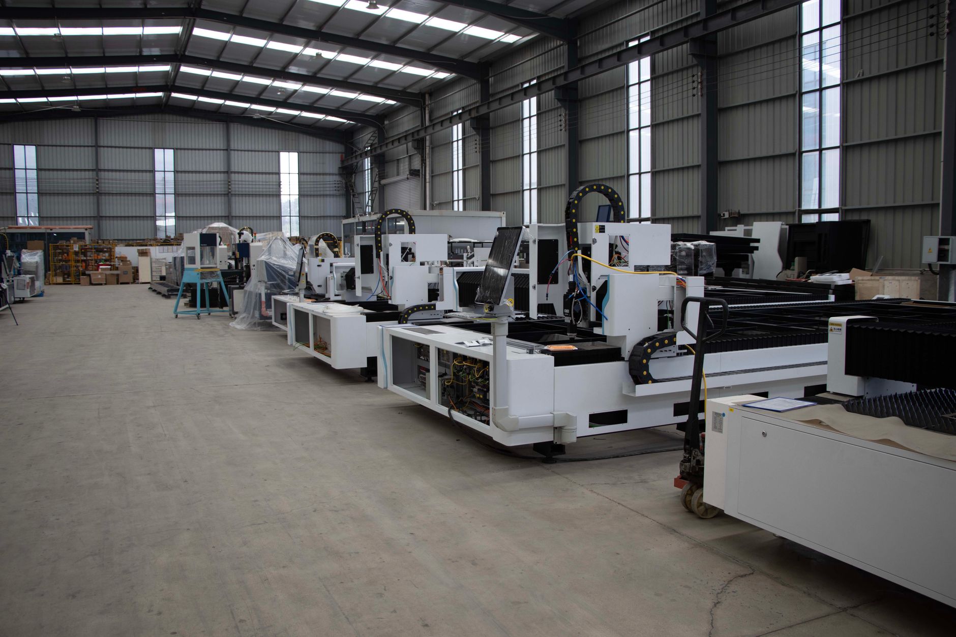 industrial manufacturing machinery inside warehouse