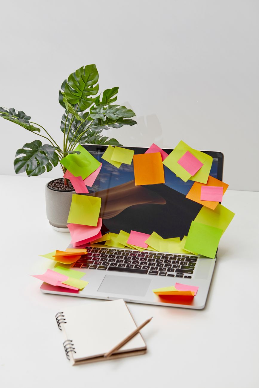 colored sticky notes on a laptop