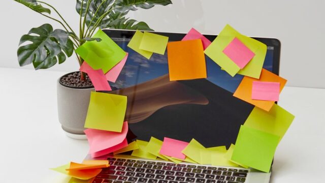 colored sticky notes on a laptop